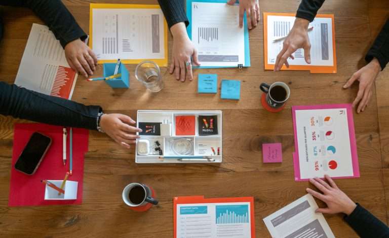 Image showing a group of office workers at a table together