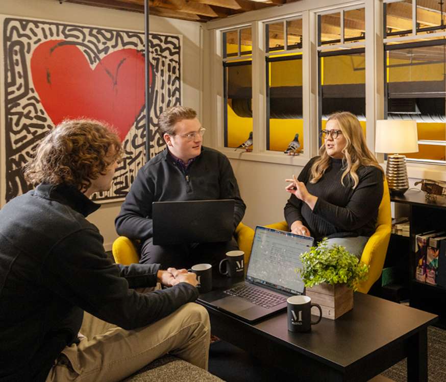 Image of a group of workers discussing a project
